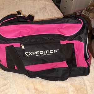 pink and black suitcase